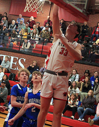 Lee Forsmann scores 2 of his 35 points against Orofino.