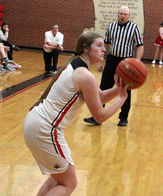 Hailey Hanson sites in a 3-point shot against C.V.