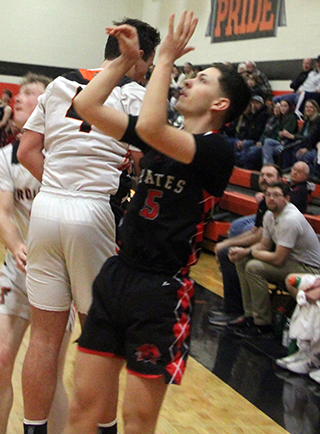 Jackson Enneking watches his 3-point shot go in at the end of the first half at Troy.