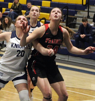 Kylie Schumacher battles for a rebound at Logos.
