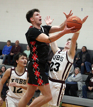 Riley Shears goes for a lay-up at Kamiah.