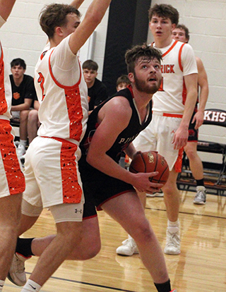 Nate Forsmann looks to shoot at Kendrick.