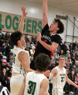 Riley Shears scores 2 of his career high 25 points at Potlatch.