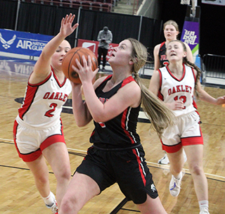 Lexi Schumacher goes for a lay-up in the championship game against Oakley. Also shown is Sage Elven.