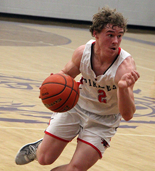 Levi Gehring handles the ball against Kendrick in the District Championship game.