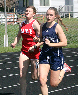 Sydney Shears passes a Logos runner and takes over first in the first lap of the 800. She went on to pull away for the win.