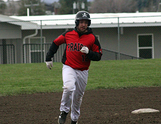 Jake Quintal rounds second in his home run trot after hitting a 2-run homer against Lapwai. The ball landed on the corner of the K-1 building where you can see the roof drain behind him.