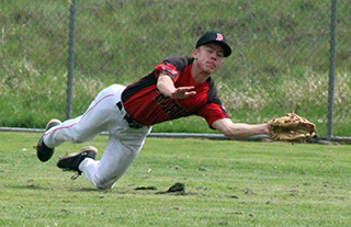 Levi McElroy makes a diving catch in centerfield in the first Troy game.