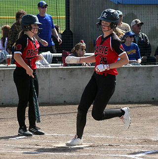 Catherine Seubert scores Prairie's only run against Genesee at District.
