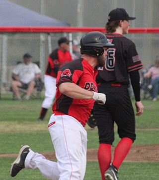 Jake Quintal hits a double that gives Prairie a 1-0 lead in the opener agaisnt C.V.