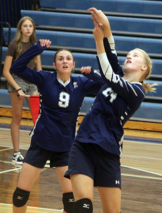 Catherine Beckman and Catherine Seubert go after the ball at Genesee.