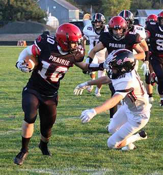 Chris Schumacher stiff arms a Deary defender on the way to a 16 yard gain.