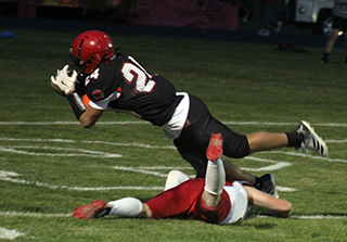 Isaiah Warren completes a juggling catch for a go-ahead touchdown against Council.