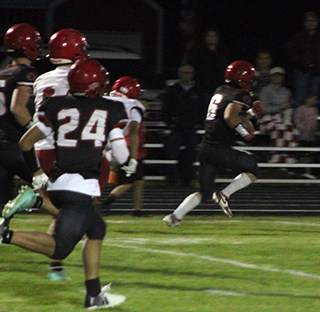 Payton Stamper broke loose for an 81 yard run that flipped the field after a goal line stand by the Pirate defense. #24 is Isaiah Warren.