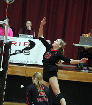 Avery Riener at the net against Kendrick last Tuesday. Also shown is Kylee Riggers.