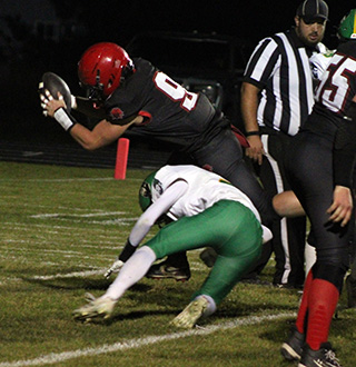 Normally the center, senior Ashton Martin got the chance to carry the ball on a 2-point attempt and scored. At right is Corbyn Tacke.