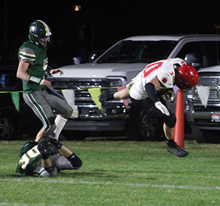 Chris Schumacher went airborne into the end zone over a Potlatch defender for one of his 3 touchdowns.