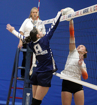 Catherine Beckman has the upper hand on this joust at the net against Kendrick.