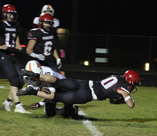 Chris Schumacher dives into the end zone for one of his 3 touchdowns. Also shown are Max Rehder and Payton Stamper.