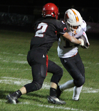 Levi Gehring sacks Troy’s quarterback near the Trojan goal line. This play set up a safety on the next play.