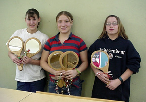 Becky Gehring, Meghan Vanderpass and Eric Tassel with hand mirrors built for the long-term care patients.