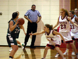 Ashley Jackson, Natalie Arnzen and Karel Wassmuth play defense against Potlatch.