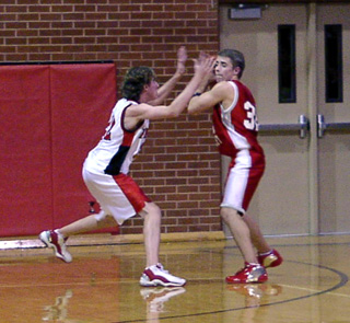 Jacob Nuxoll plays defense against C.V. He scored a varsity career high 14 points in the game on 7 for 8 shooting.