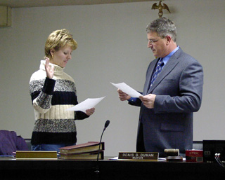 Shelli Schumacher is sworn in by mayor Duman after being appointed to the position.