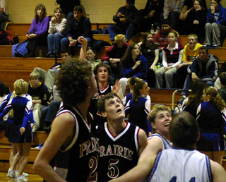 Jacob Nuxoll and Jake Chaffee look to rebound Tyler Crane's 3-point attempt.