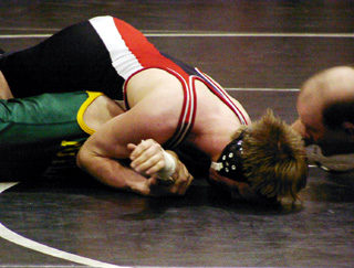 Shane Poxleitner scores near fall points in his opening round match.