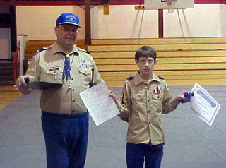Kyle Bruegeman, with scoutmaster Bob Behler, was the overall winner of the Pinewood Derby.