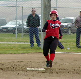 Maureen Tacke pulls into second with a double.