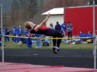 Vanessa Sonnen clears the bar on her way to a win in the high jump.