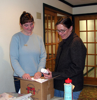 Beth Richarson and Barb Michels with a case of free folic acid.