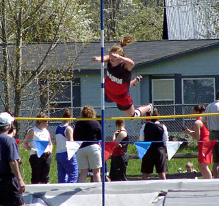 Briget Long clears a height in the pole vault.