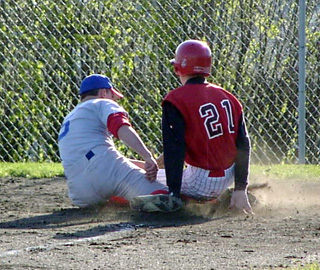 C.J. Rieman scores Prairie's first run against Orofino on a passed ball.