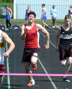 Maurizio Henau competes in a preliminary heat of the 100 meter dash.
