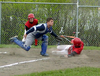 Tyler Crane was called out at the plate on this play. Brent Frei who had scored ahead of Tyler watches.