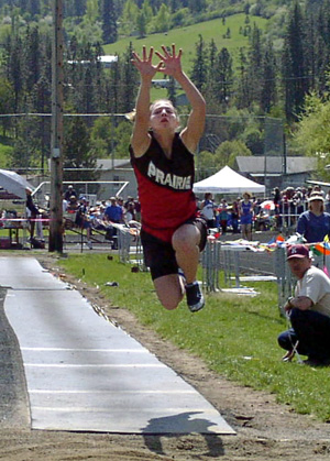 Vanessa Sonnen reaches for the pit in the triple jump. She placed third.