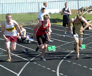Brandon Crea at the start of a 100 meter dash heat.