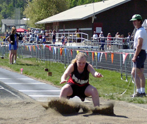 Lauren Merrill hits the pit in the long jump. She finished 3rd in the event.