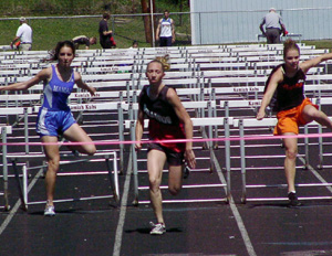 Tabitha Sonnen wins the 100 meter hurdles.