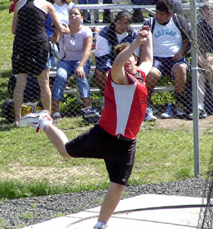 J.D. Riener tosses the discus.