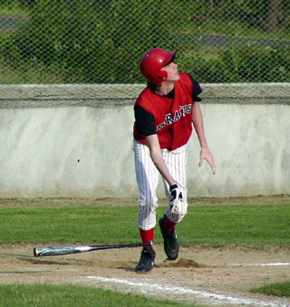 Jacob Nuxoll heads toward first as his bloop single heads for a safe landing in the outfield.