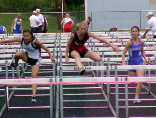 Tabitha Sonnen leads at the final barrier as she wins the 100 hurdles.