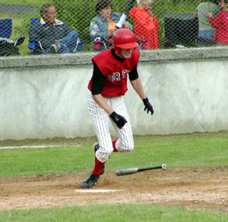 Brent Frei digs for first. He had 5 hits and 6 RBI in the state tournament.