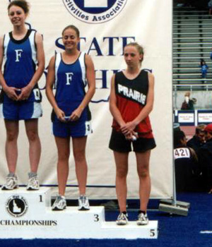 Tabitha Sonnen on the awards stand after receiving her 5th place medal in the 100 hurdles.