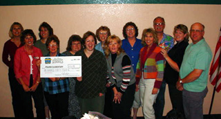 The Prairie Elementary staff with the check they received in the Idaho Lottery Scratch for Schools program.