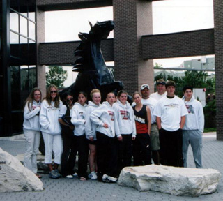 The state track qualifiers and coaches in front of the Bronco at Bronco Stadium.