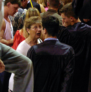 Irma Tacke congratulates foreign exchange student Mauricio Henao.
